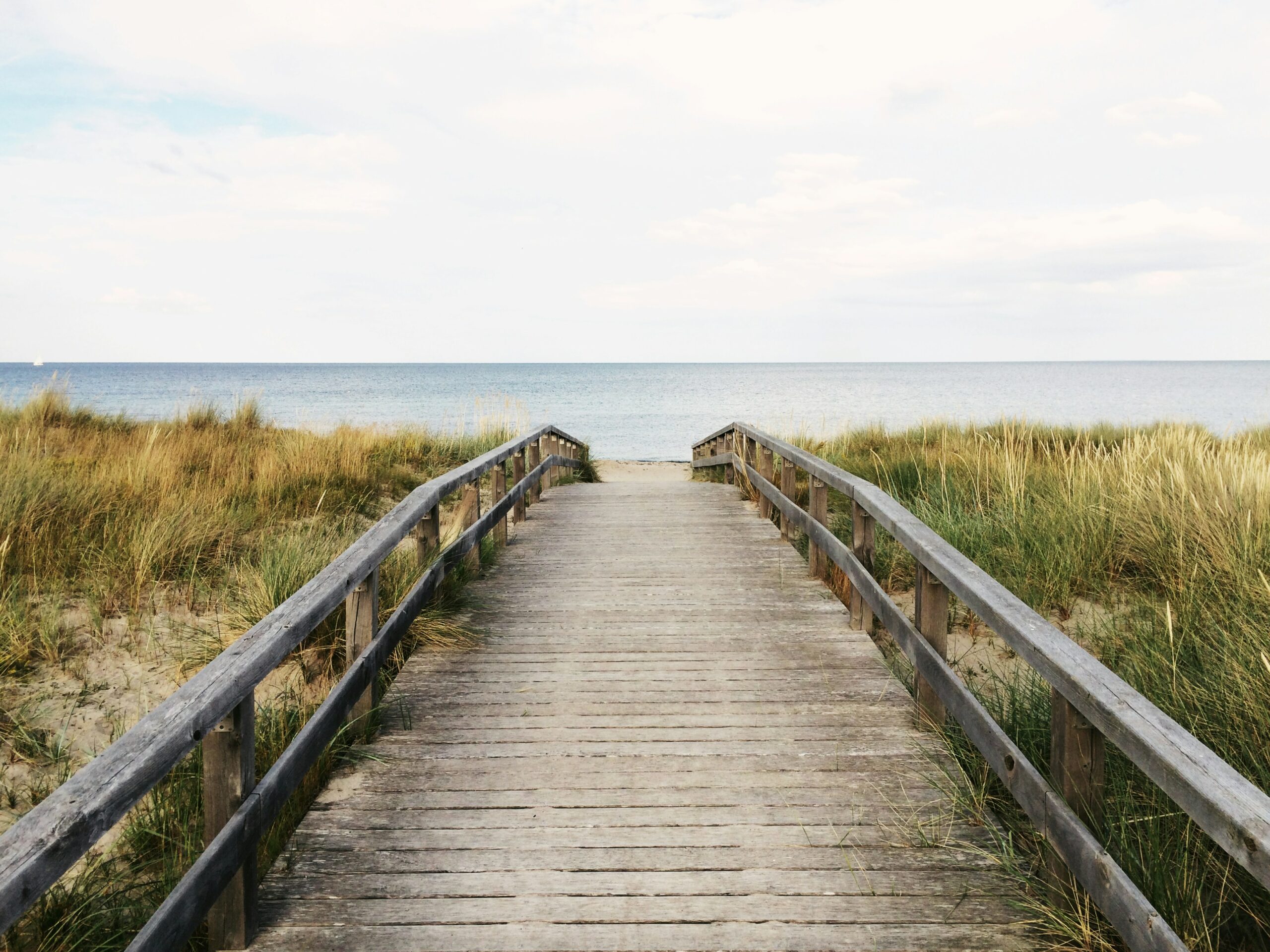 A picture of a boardwalk leading to the beach